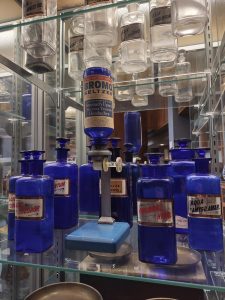 Antique pharmacy bottles displayed in the exhibit
